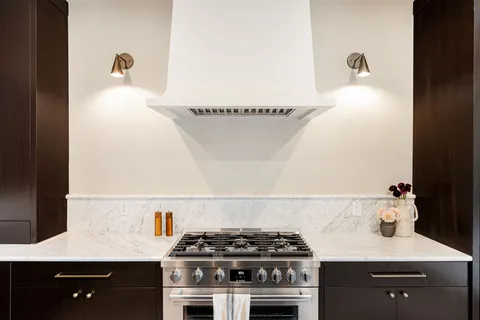 a kitchen with a stove and a refrigerator