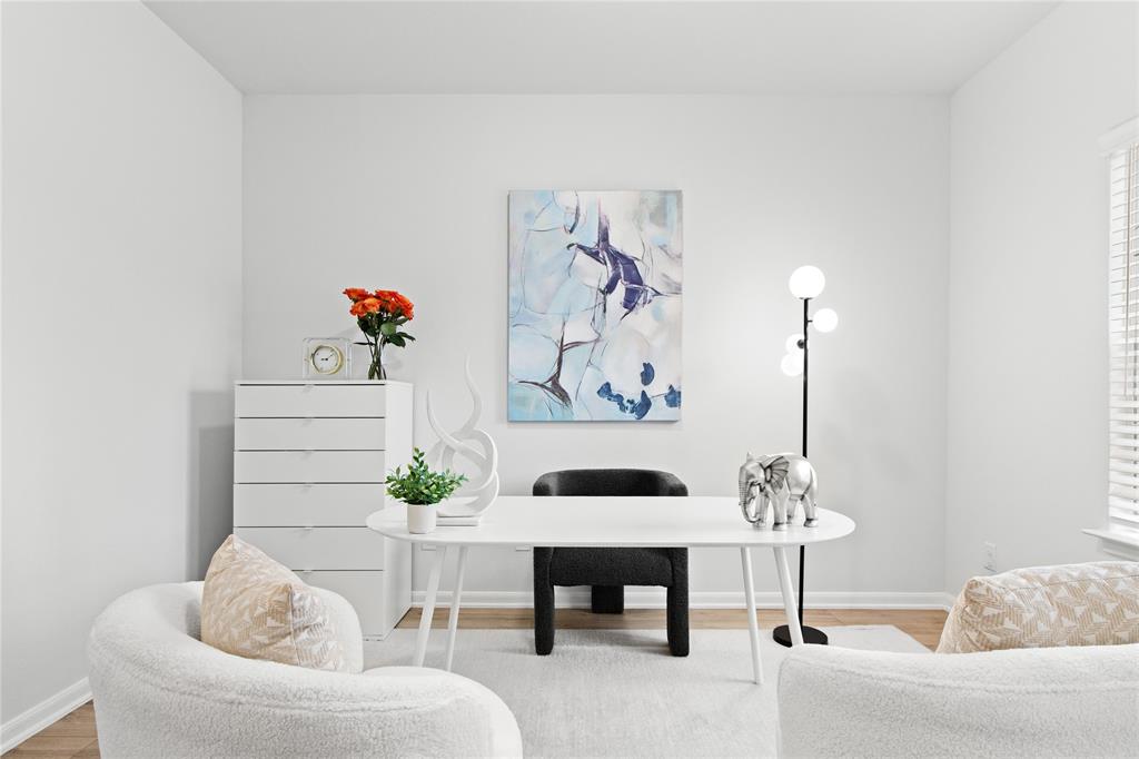 2070 Placerville Street Forney, TX 75126 - Photo 18 of 36 a living room with furniture and flowers