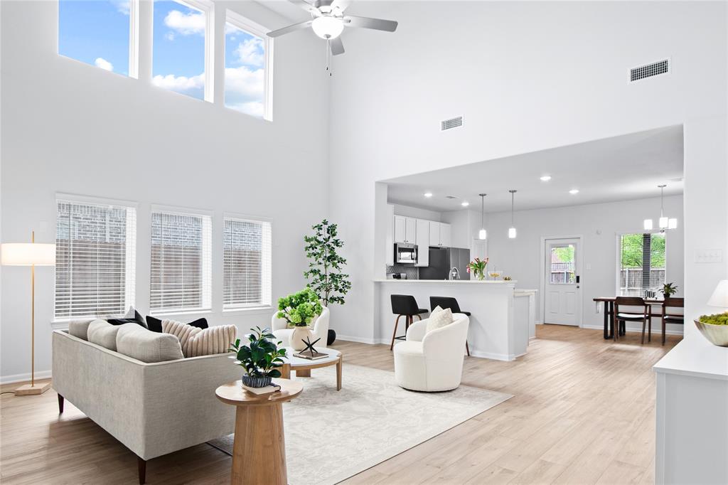 2070 Placerville Street Forney, TX 75126 - Photo 2 of 36 a living room with furniture potted plant and windows