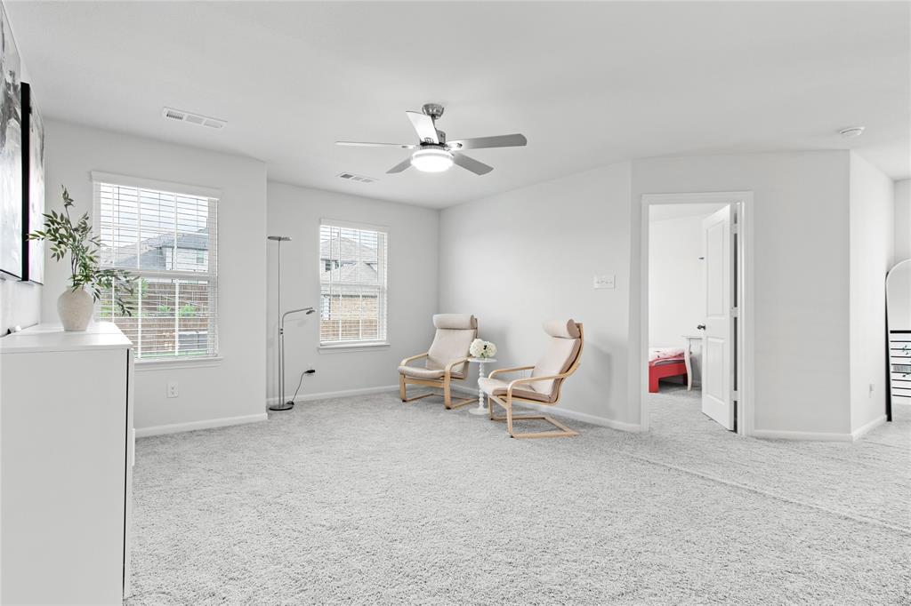 2070 Placerville Street Forney, TX 75126 - Photo 22 of 36 a living room with furniture and a window