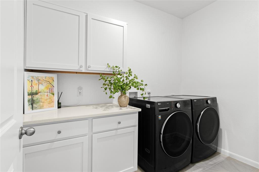 2070 Placerville Street Forney, TX 75126 - Photo 31 of 36 a utility room with dryer and washer