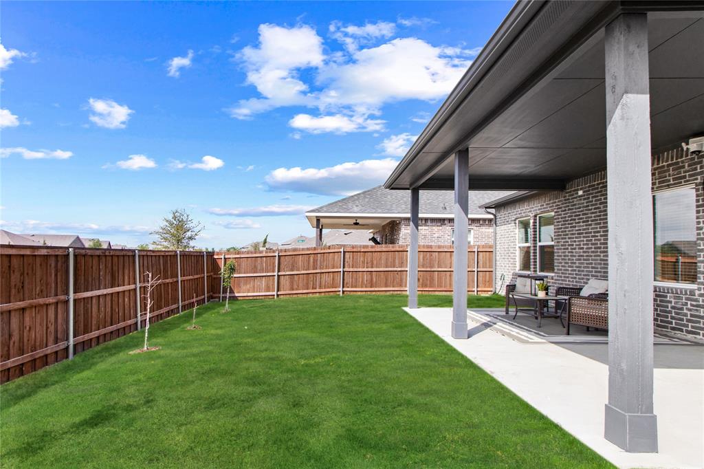 2070 Placerville Street Forney, TX 75126 - Photo 33 of 36 a view of a backyard with sitting area
