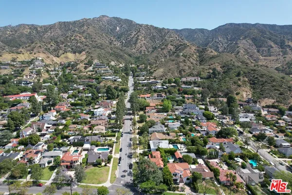 an aerial view of residential house and green space
