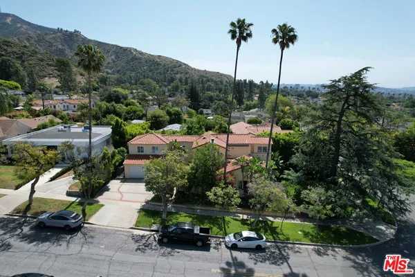 an aerial view of a houses with outdoor space and street view
