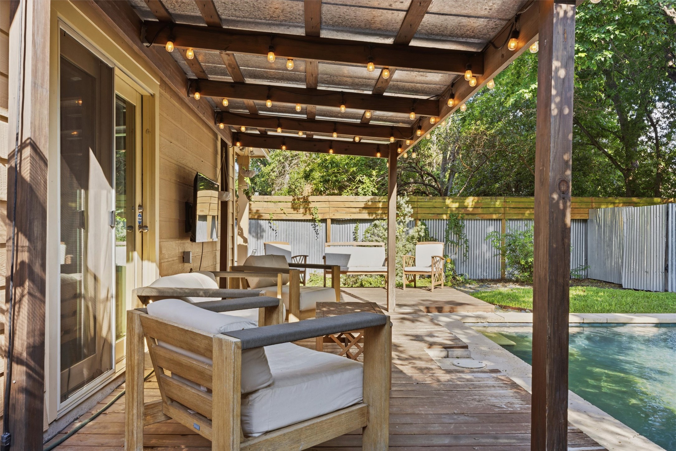 3015 Castro Street Austin, TX 78702 - Photo 39 of 40 A private deck provides an ideal setting for relaxation beside a cool, inviting pool.