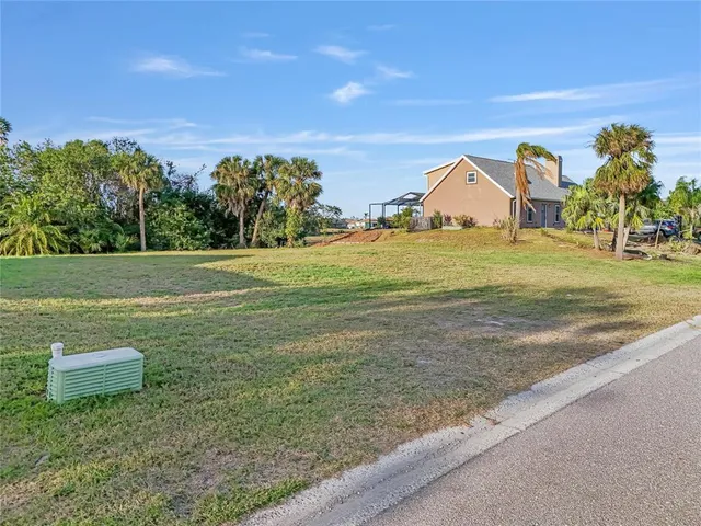 a view of a green field with clear sky