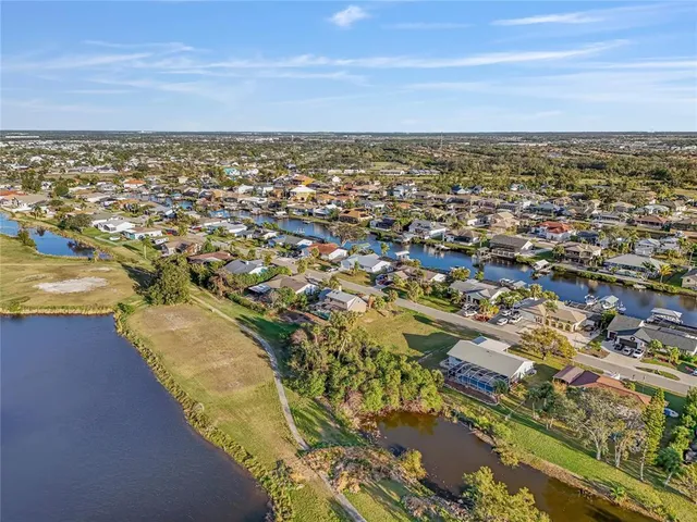 an aerial view of residential building and ocean