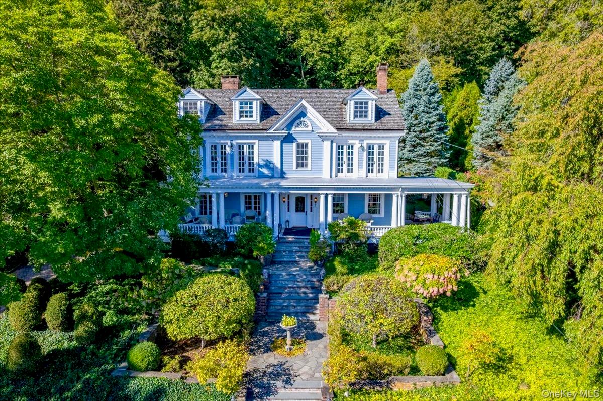 a front view of house with yard and green space