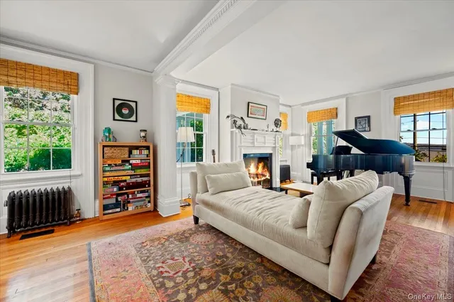 a dining room with furniture a rug and a chandelier