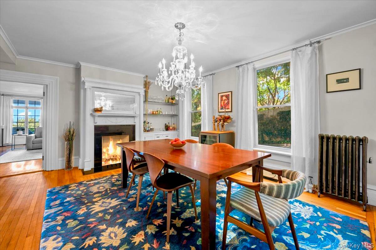 245 River Road Nyack, NY 10960 - Photo 14 of 45 a dining room with furniture a rug and wooden floor
