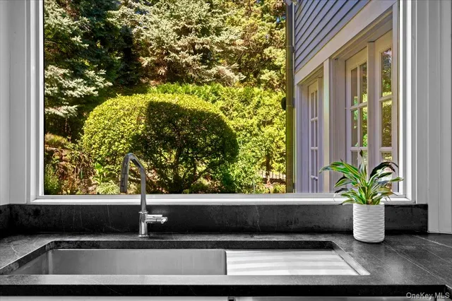a kitchen with stainless steel appliances a stove and a sink