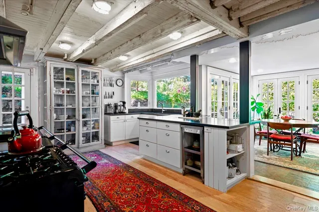 a dining room with furniture window and outside view