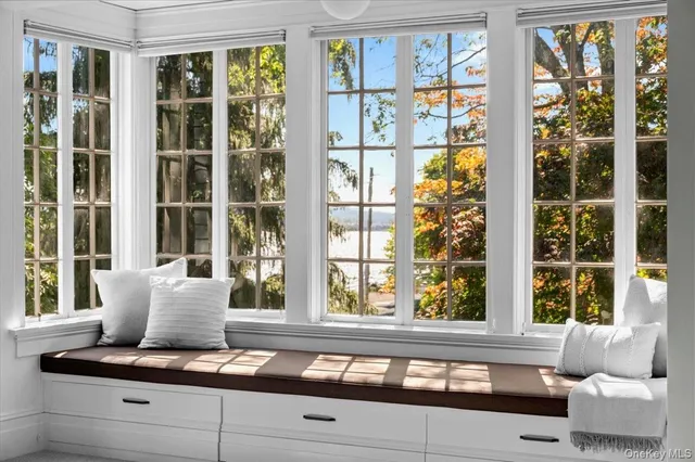 a spacious bedroom with a bed and a fireplace