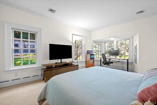 a bedroom with a bed and a fireplace