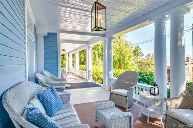 a view of balcony with wooden floor