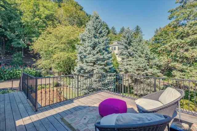 a view of a house with a table and chair in the patio