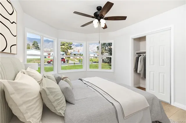 a bedroom with a bed and a window