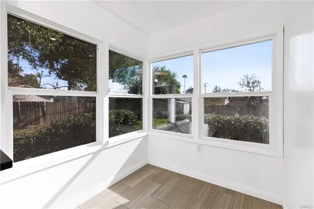 a view of a balcony with wooden floor and outdoor space