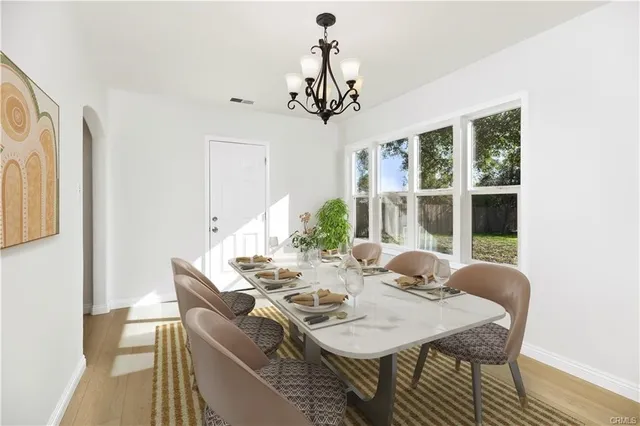 a view of a dining room with furniture window and outside view
