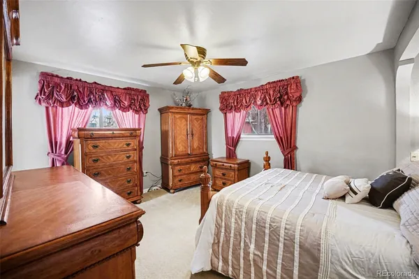 a bedroom with a bed and dresser