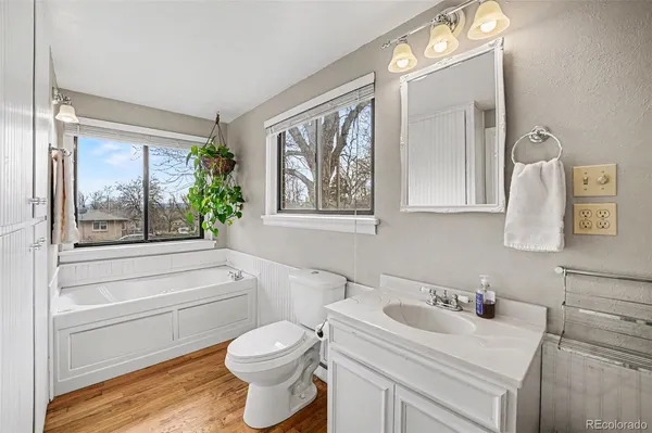 a bathroom with a toilet a sink and a bathtub