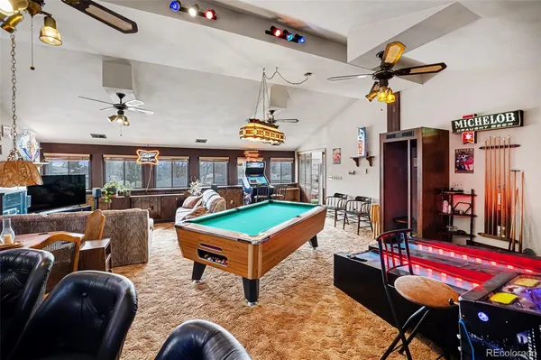 a living room filled with furniture and a flat screen tv