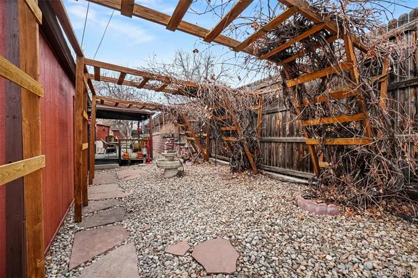 a view of a backyard with a tree