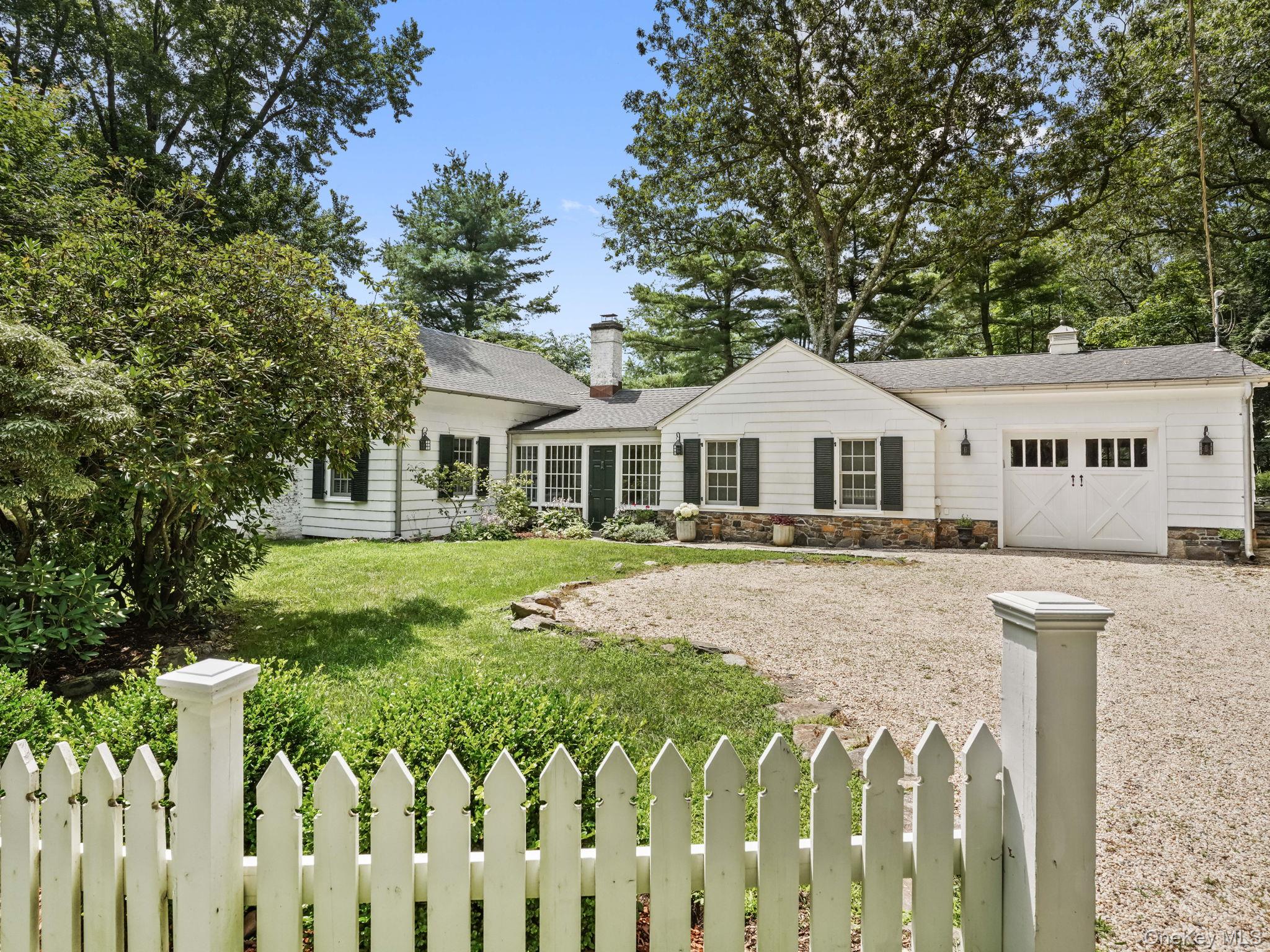 8 South Bedford Road Pound Ridge, NY 10576 - Photo 32 of 32 a front view of a house with a yard