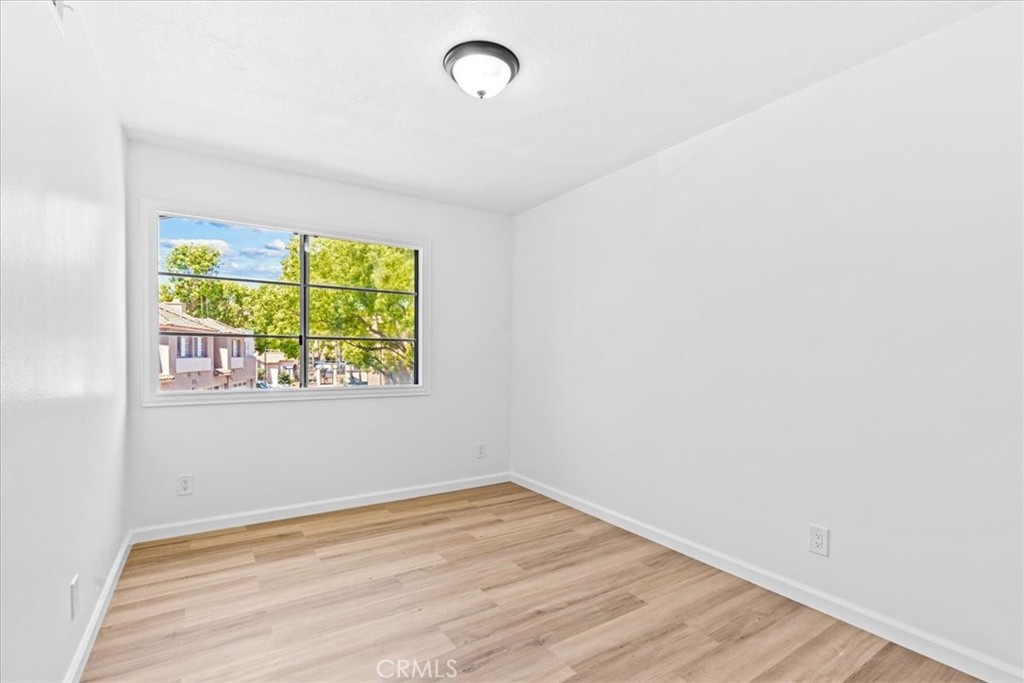 19 Softwind Aliso Viejo, CA 92656 - Photo 12 of 28 an empty room with window and wooden floor