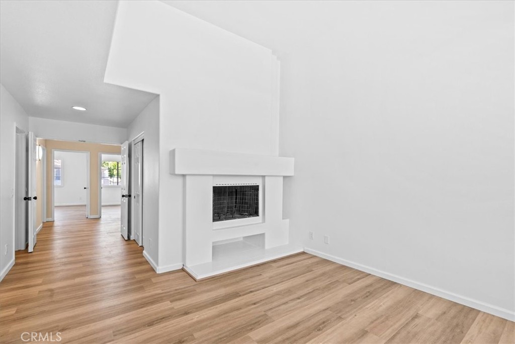 19 Softwind Aliso Viejo, CA 92656 - Photo 19 of 28 a view of a hallway with wooden floor