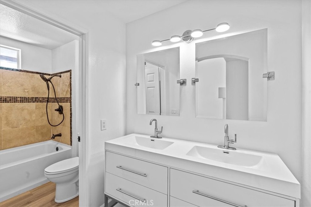 19 Softwind Aliso Viejo, CA 92656 - Photo 23 of 28 a bathroom with a sink a toilet and shower