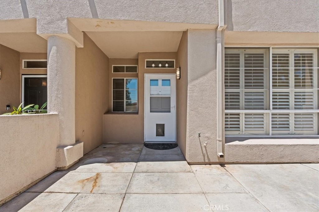 19 Softwind Aliso Viejo, CA 92656 - Photo 26 of 28 a view of a brick house with many windows