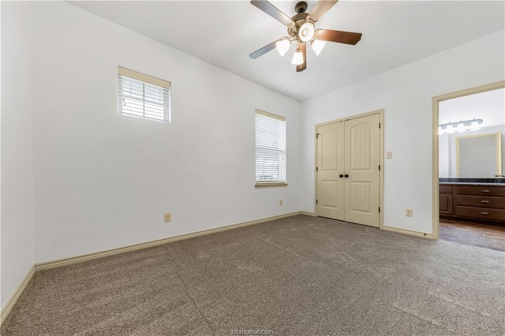 4327 Commando Trail College Station, TX 77845 - Photo 16 of 23 a view of a livingroom with a ceiling fan and window