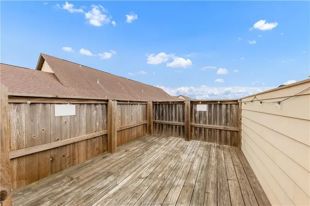 a balcony with wooden floor