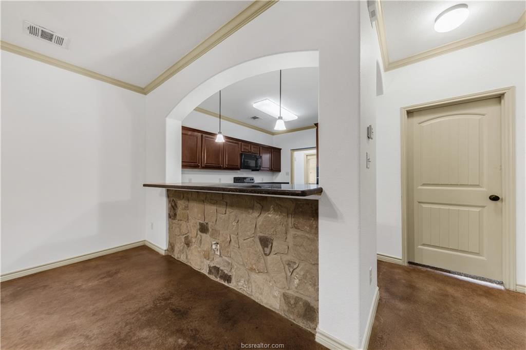 4327 Commando Trail College Station, TX 77845 - Photo 10 of 23 a view of kitchen with cabinets and wooden floor