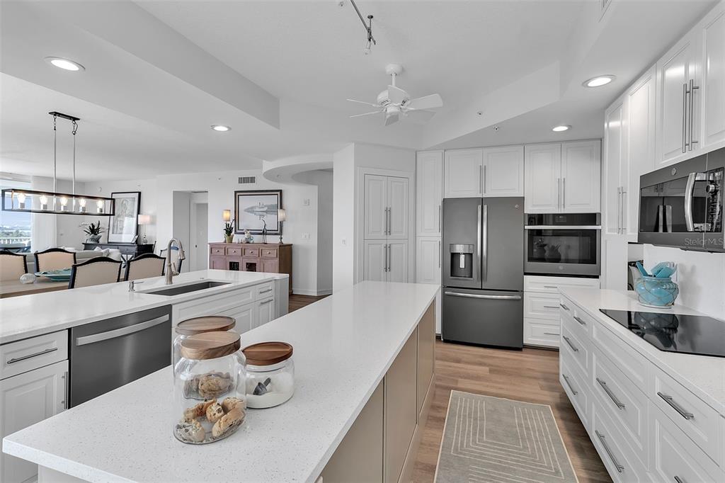 393 North Point Road, Unit 401 Osprey, FL 34229 - Photo 23 of 62 a large kitchen with stainless steel appliances lots of counter space and breakfast area