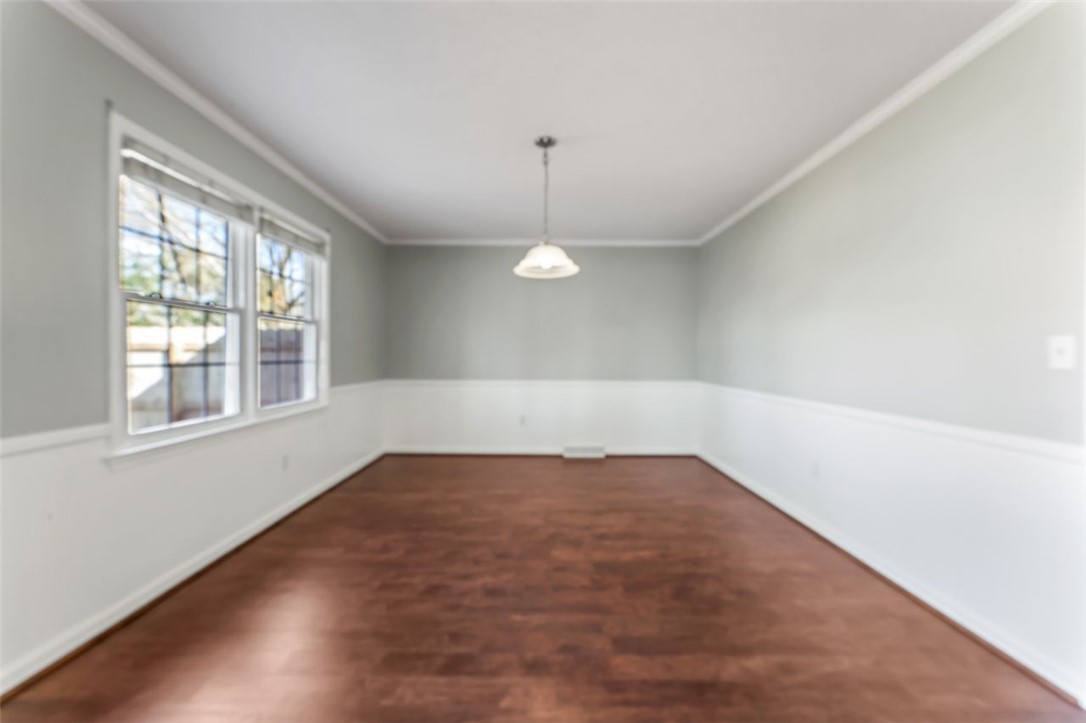 304 Stonehaven Drive Anderson, SC 29625 - Photo 5 of 19 Hardwood floors and ample natural light define this versatile room, ready for your personal touch.