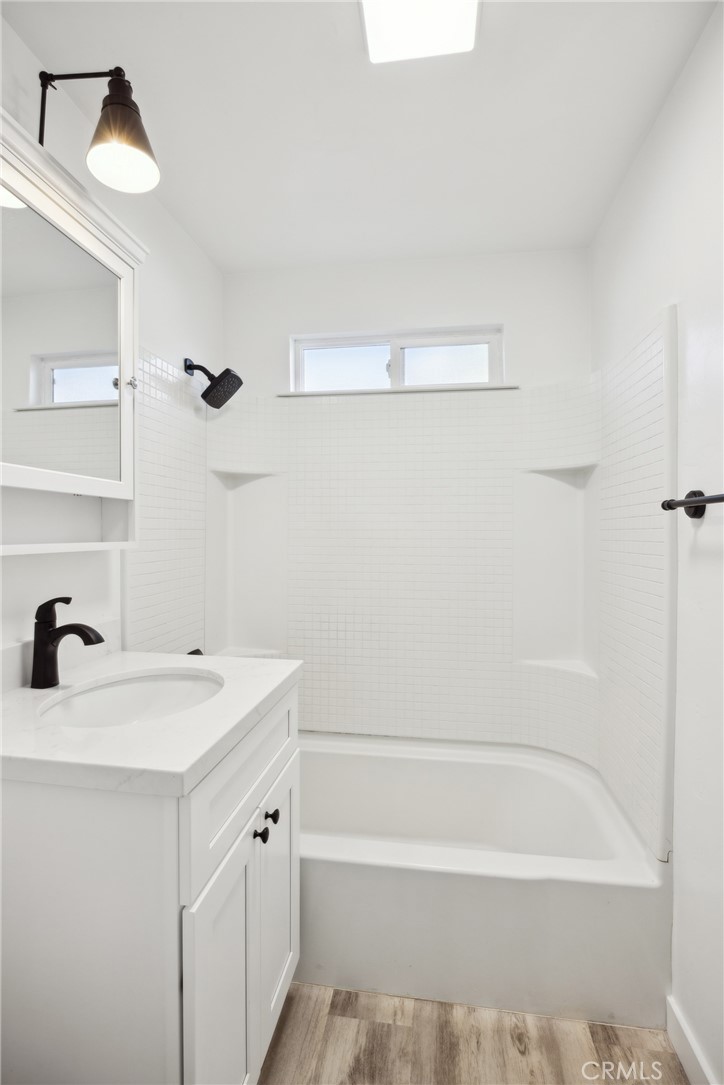 528 Creston Road Paso Robles, CA 93446 - Photo 16 of 46 a bathroom with a sink a mirror and a bathtub