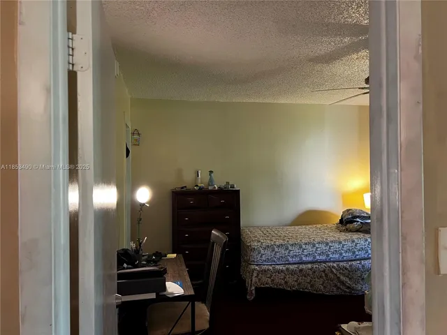 a bedroom with a bed and cabinets
