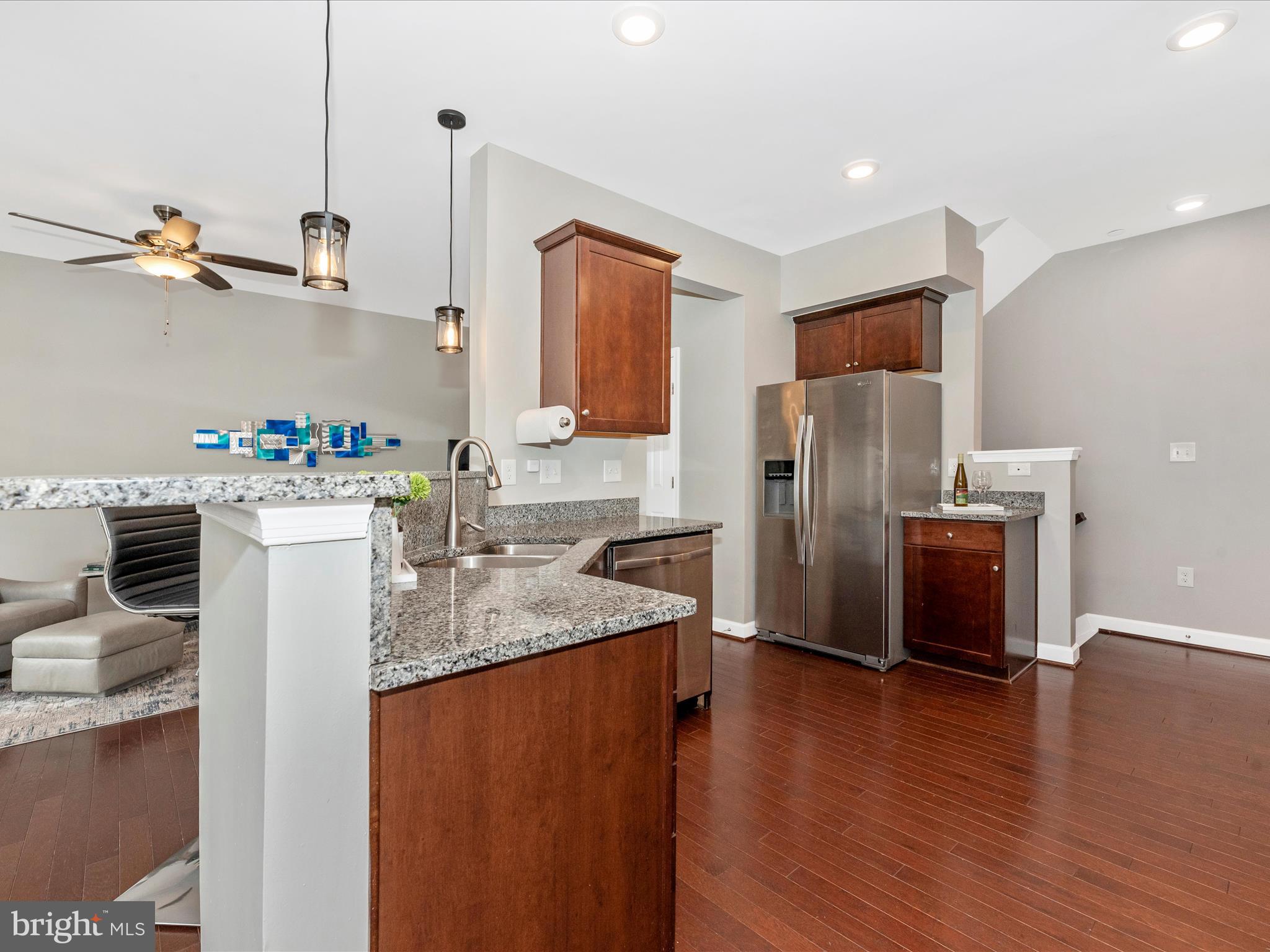 5920 Forum Square Frederick, MD 21703 - Photo 12 of 56 a kitchen with a refrigerator and a sink