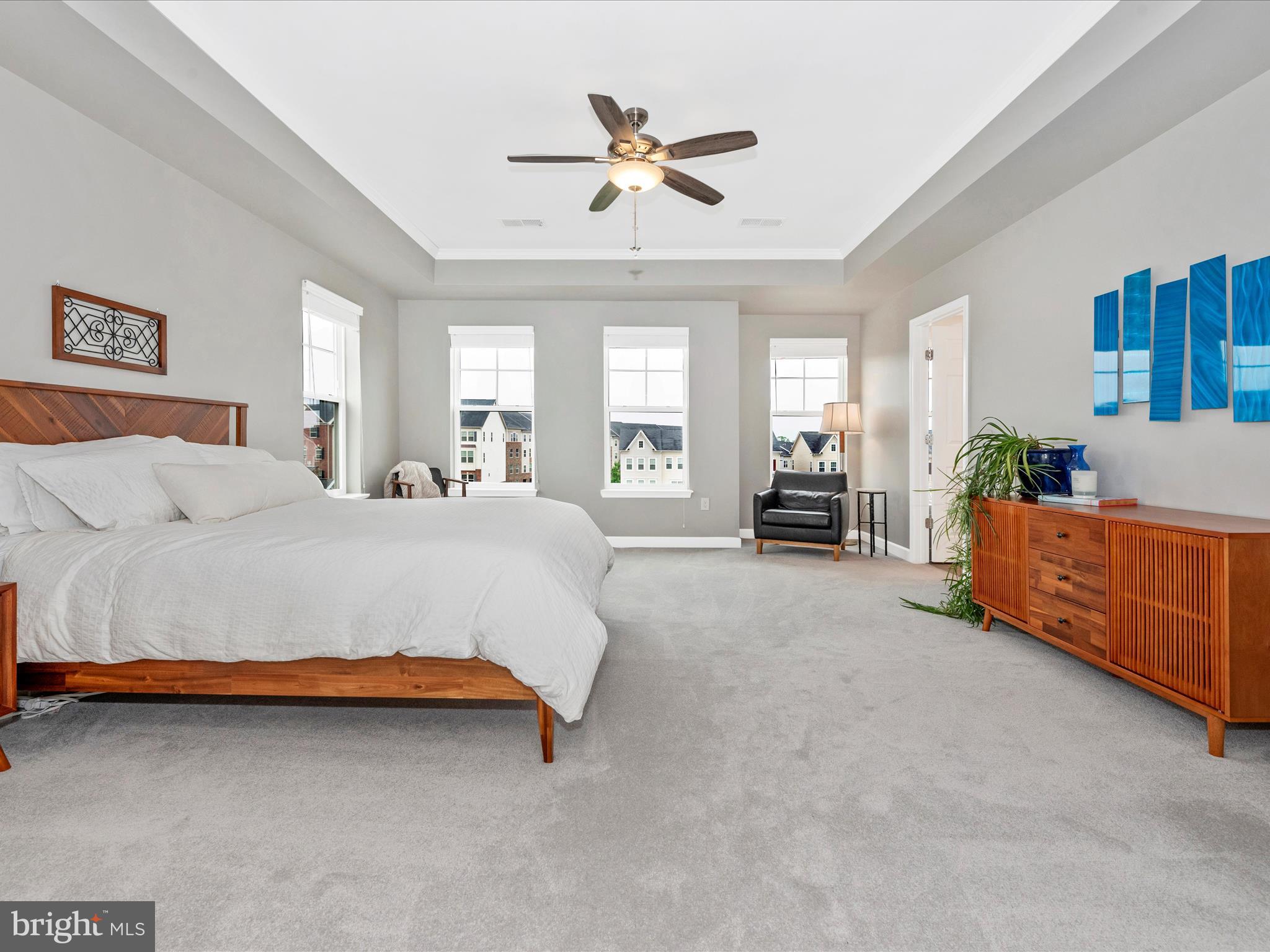 5920 Forum Square Frederick, MD 21703 - Photo 19 of 56 a spacious bedroom with a bed and ceiling fan