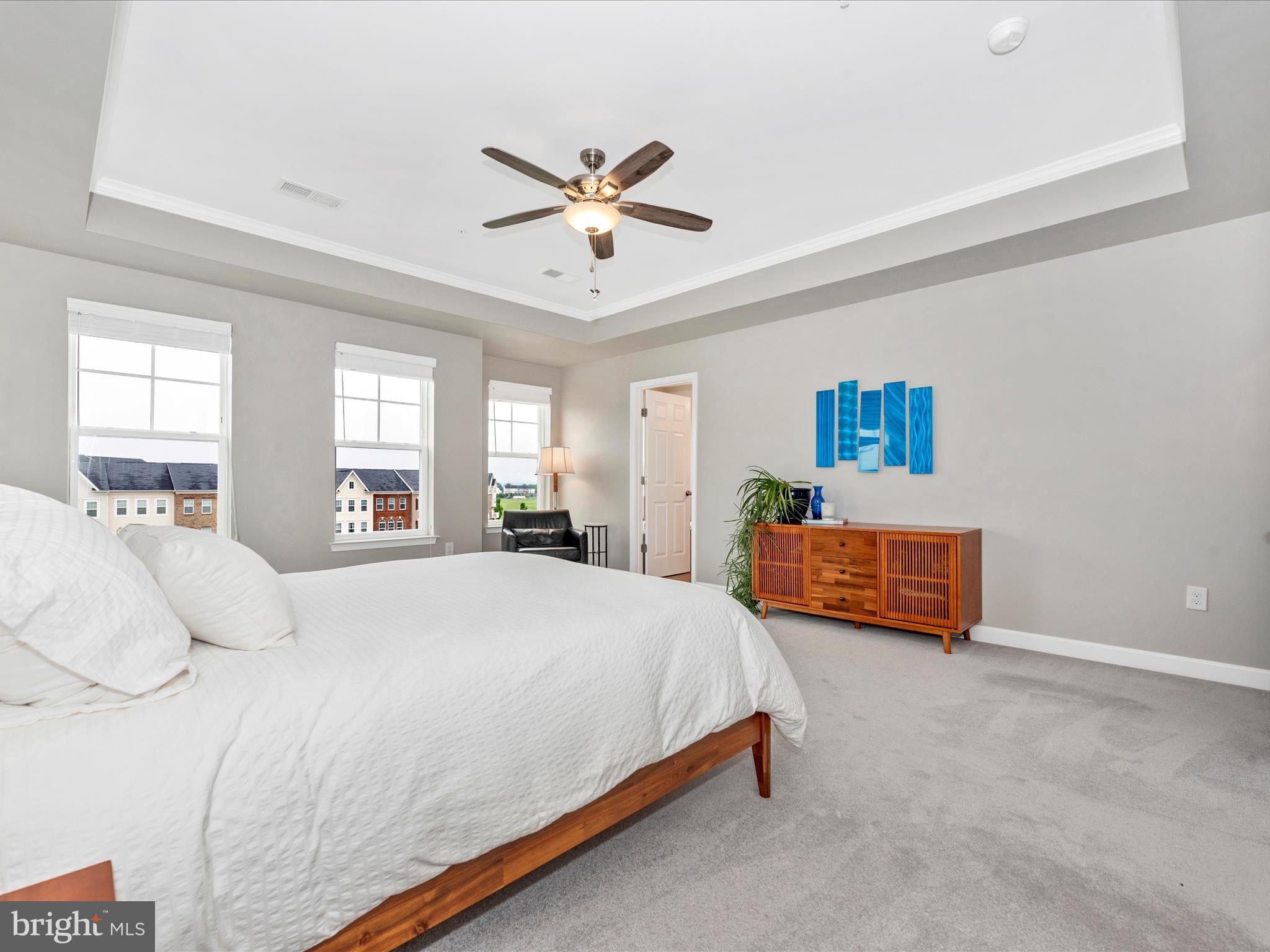 5920 Forum Square Frederick, MD 21703 - Photo 20 of 56 a bedroom with a bed and a chandelier