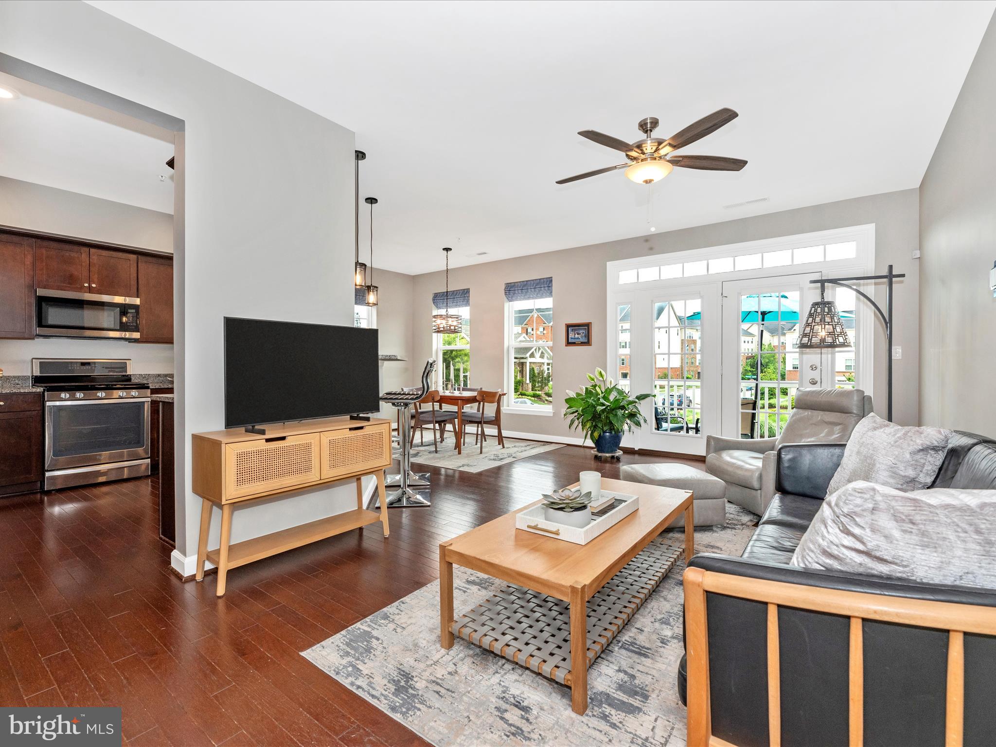 5920 Forum Square Frederick, MD 21703 - Photo 2 of 56 a living room with furniture a flat screen tv and a window