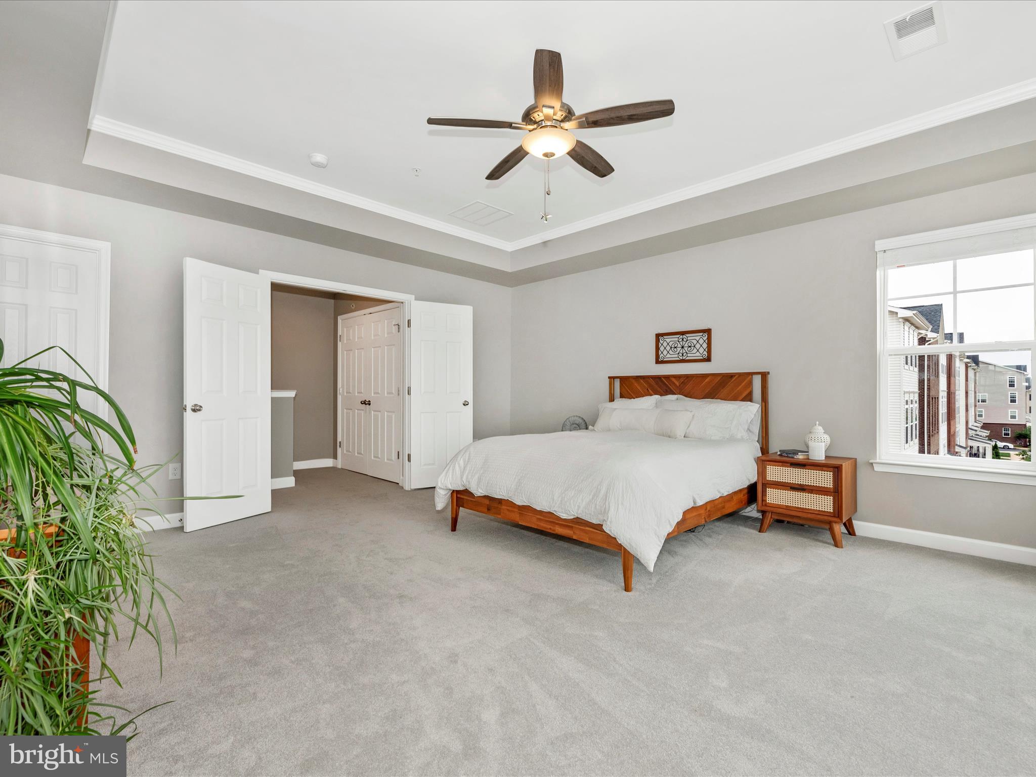 5920 Forum Square Frederick, MD 21703 - Photo 22 of 56 a bedroom with a bed and a potted plant