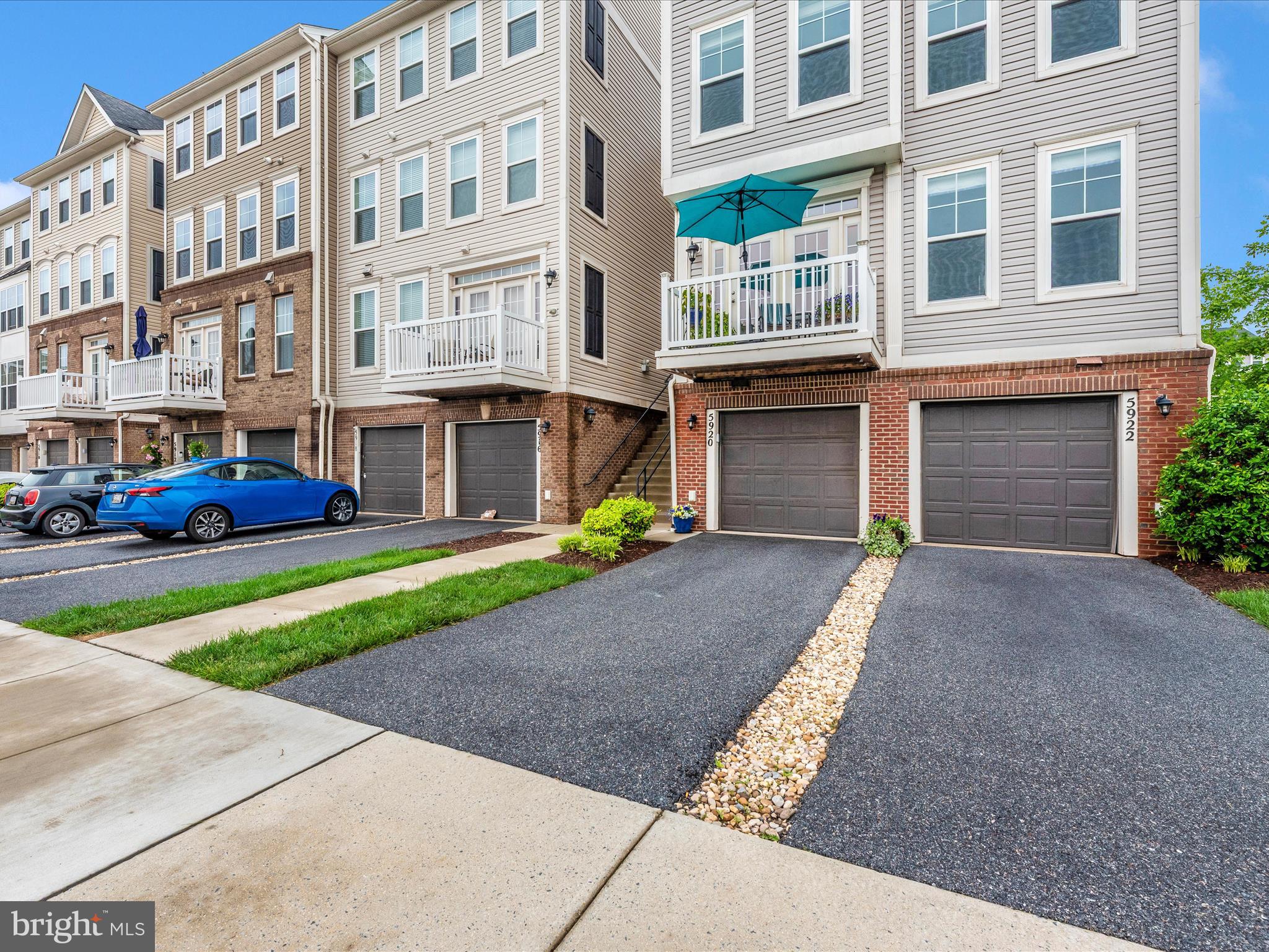 5920 Forum Square Frederick, MD 21703 - Photo 39 of 56 a front view of a building with garden and parking space
