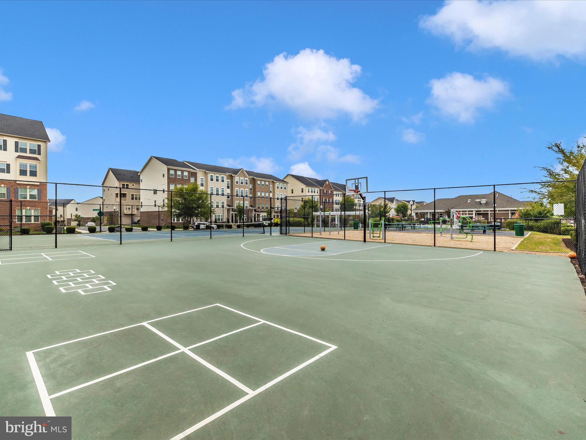 5920 Forum Square Frederick, MD 21703 - Photo 53 of 56 a view of a tennis ground with large trees