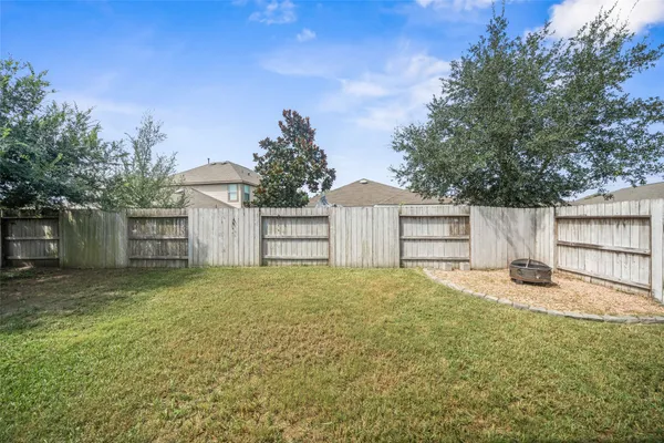 a house with a yard and a large tree