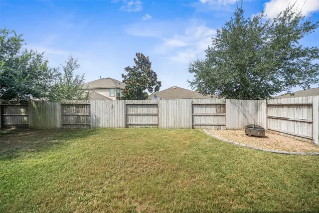 a house with a yard and a large tree
