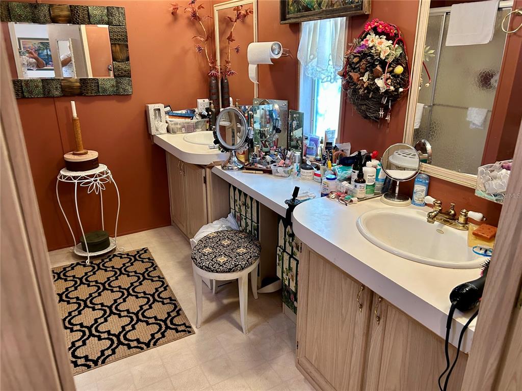 25646 Bass Road Astor, FL 32102 - Photo 14 of 48 a bathroom with a sink and a mirror
