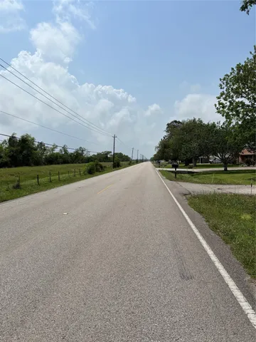 a view of a golf course with a road